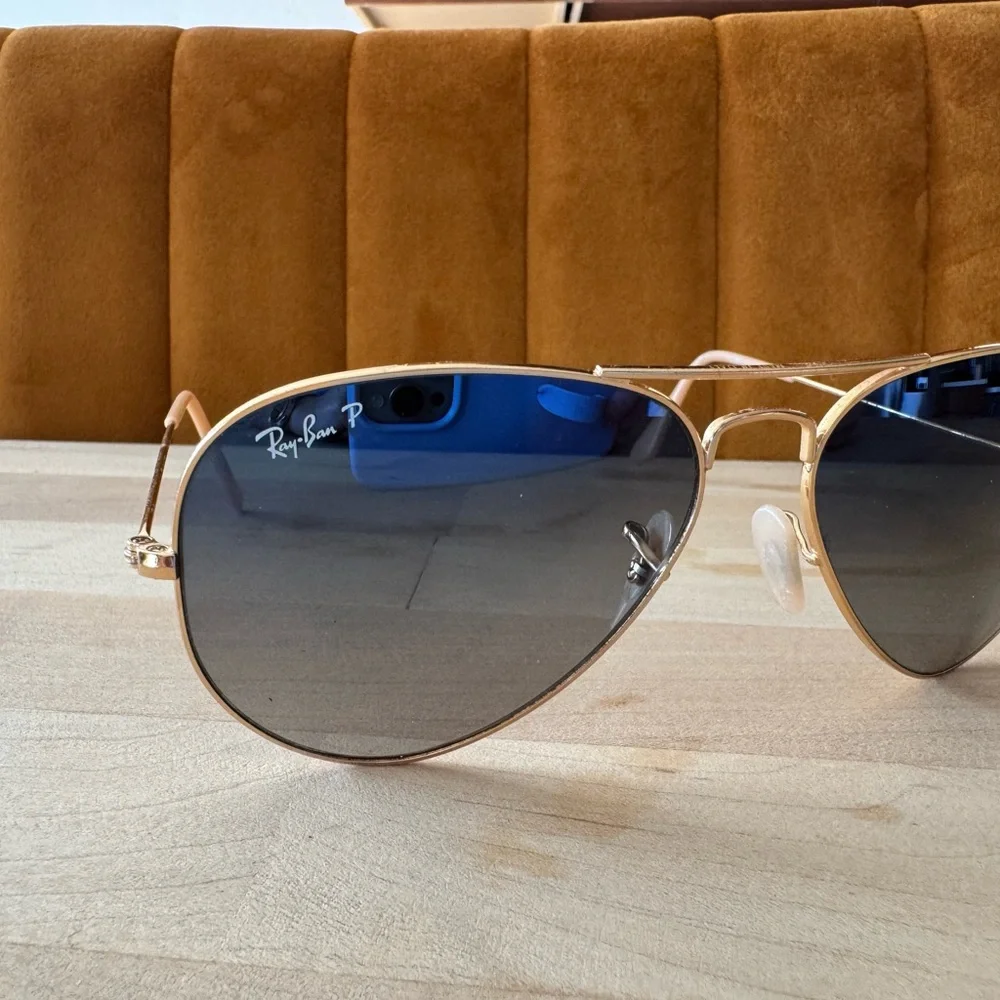 Ray-Ban Gold Frame Sunglasses with polarized Blue Lenses.